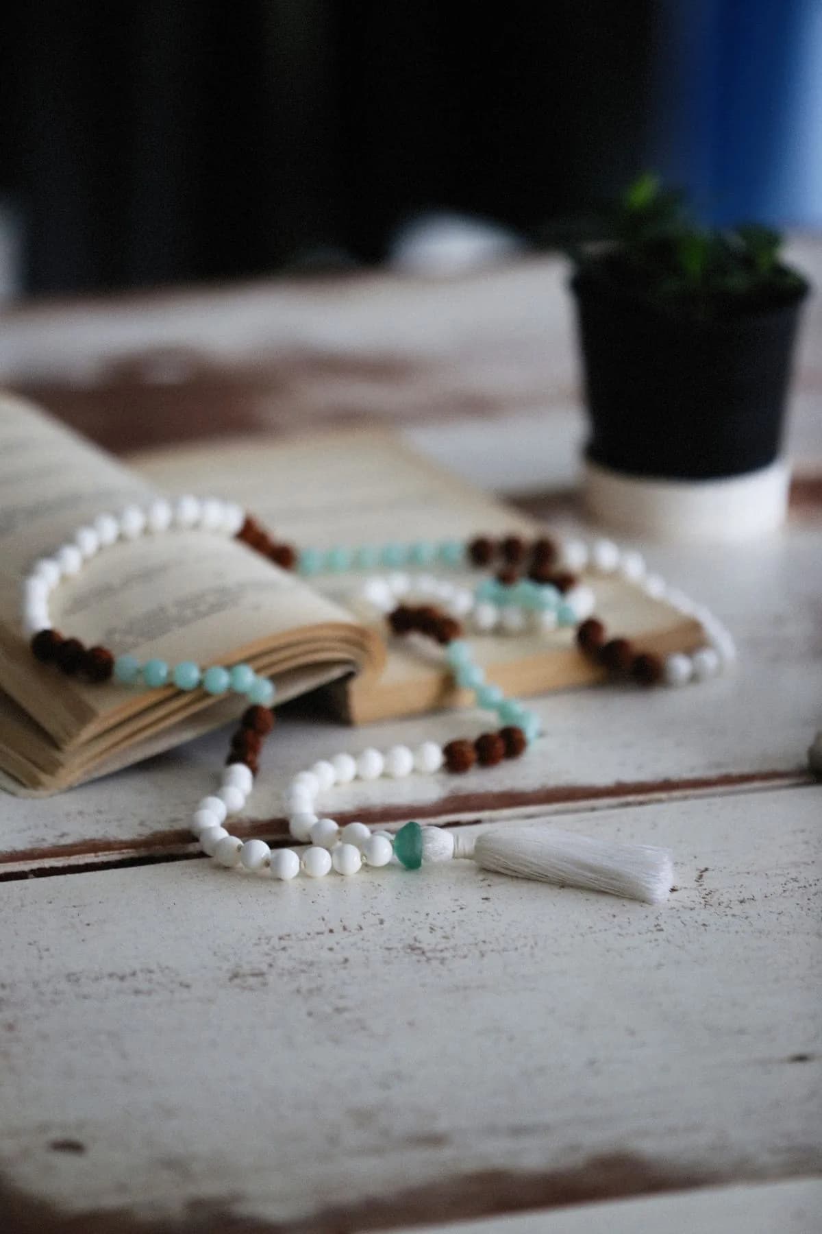 Long beaded necklace with white, brown and turquoise semi-precious beads
