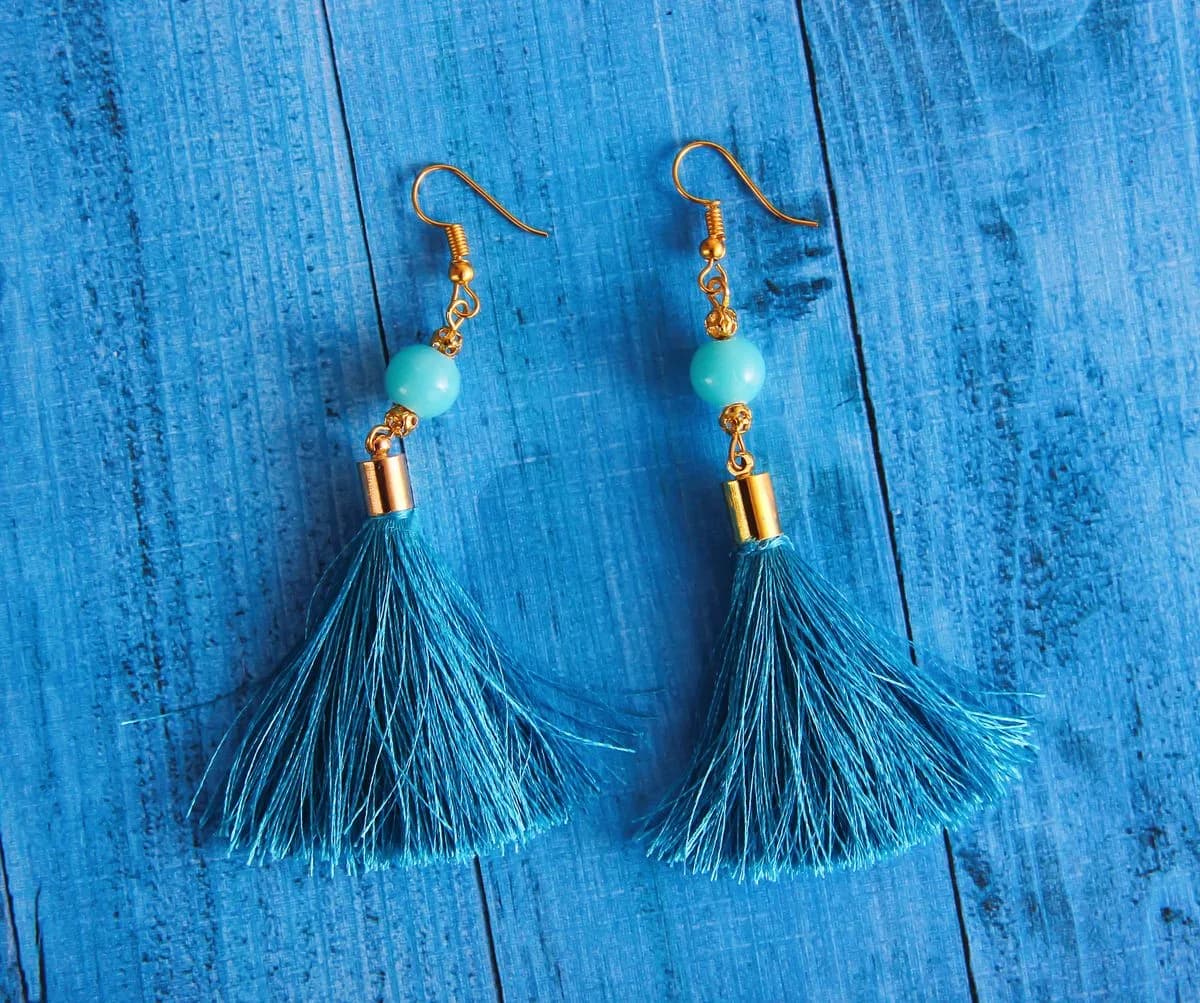 Turquoise bead and blue tassel statement earrings